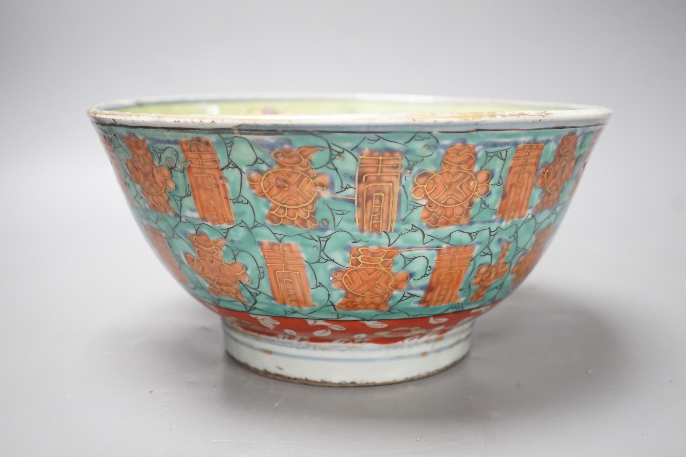 An 18th century clobbered Chinese or Japanese porcelain bowl, 24.5cm diameter